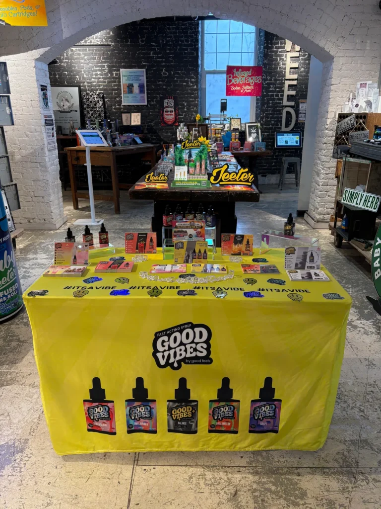 Polished branded display featuring Good Vibes products at Canna Provisions – Holyoke.