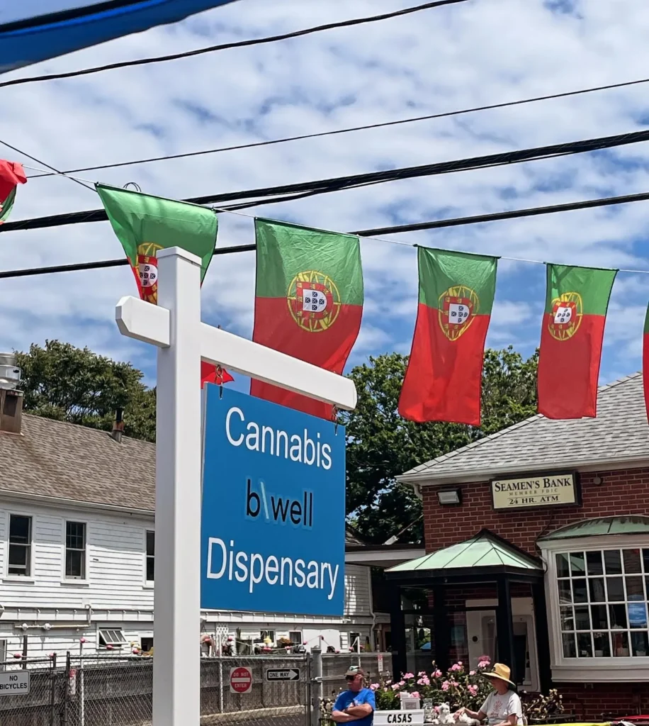 Warm branded display featuring products and signage at bwell Dispensary Provincetown.