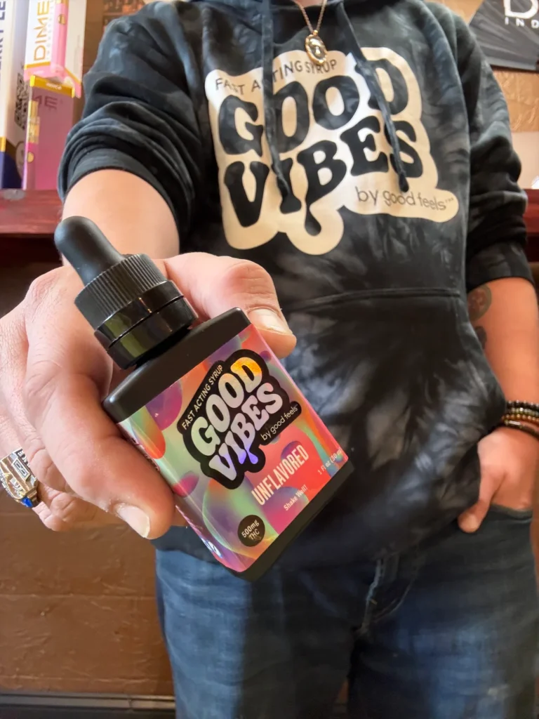 Good Vibes display materials set against warm wood surfaces at Toy Town Health Care - Winchendon.