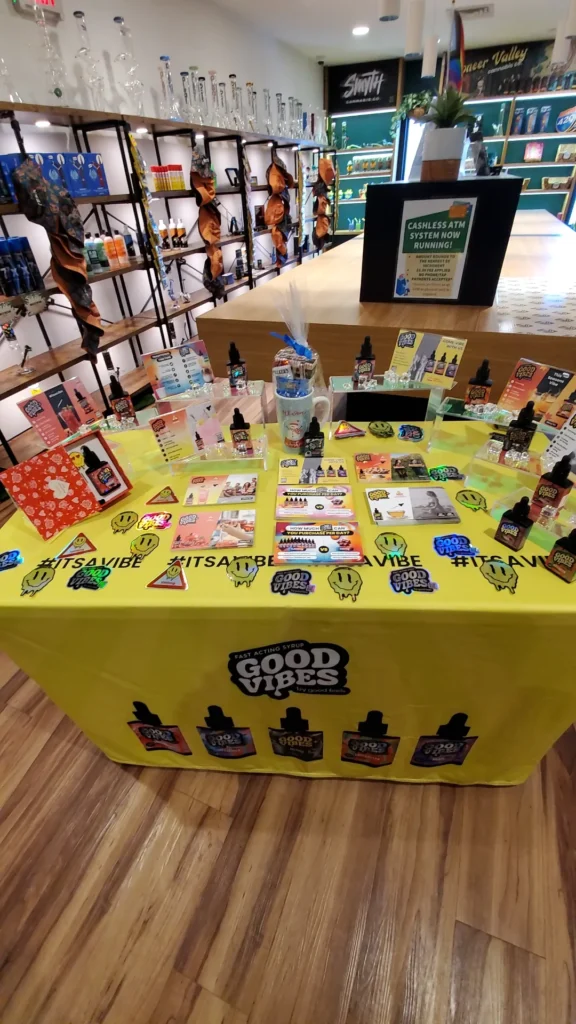 Good Vibes bottles and colorful display cards at Botera - Taunton.
