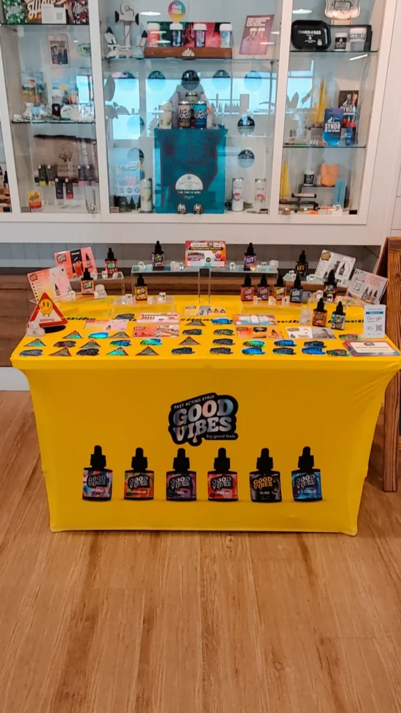 Good Vibes bottles and colorful display cards at South Shore Buds - Marshfield.