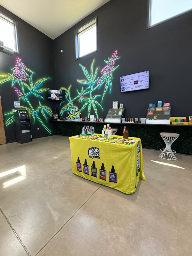 Colorful retail display featuring products and signage at Collective Premium Cannabis – Billerica.
