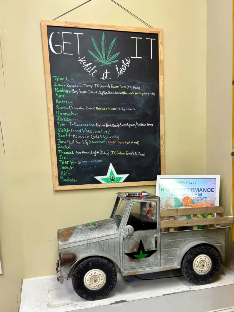 A Good Vibes sign anchoring the retail display at CNA Stores - Amesbury.