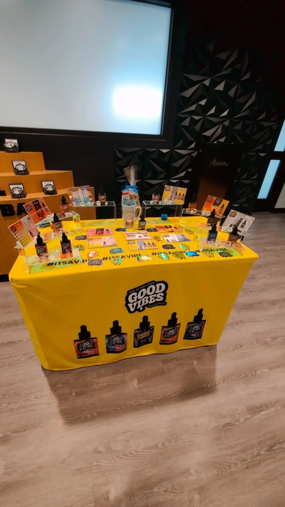 A Good Vibes sign anchoring the retail display at Aura - Fall River.