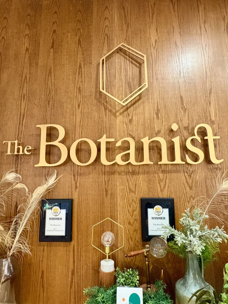 A warm-toned retail display with wood surfaces at The Botanist - Worcester.
