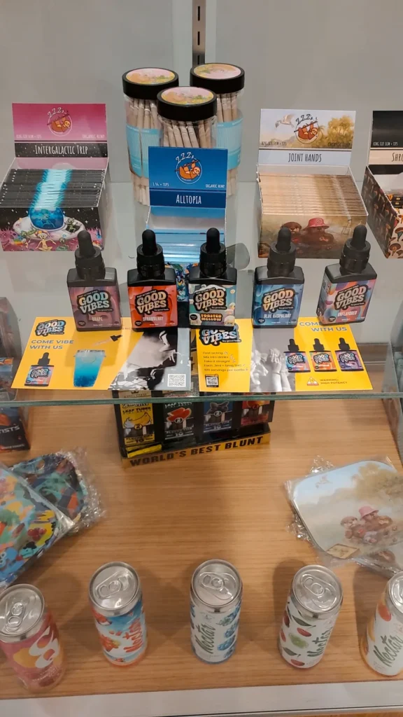 Good Vibes bottles and colorful display cards at Aura - Fall River.
