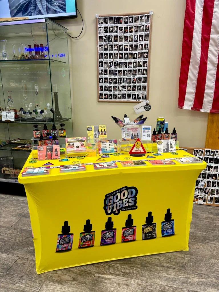 Good Vibes bottles and colorful display cards at CNA Stores - Amesbury.