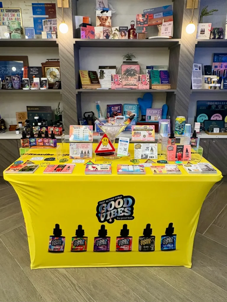 Good Vibes bottles and colorful display cards at Rooted In - Boston.
