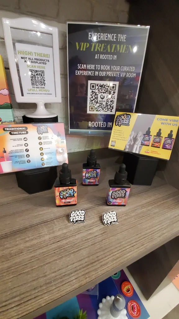 A Good Vibes sign anchoring the retail display at Rooted In - Boston.