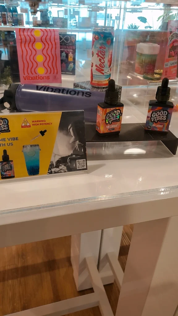 Good Vibes bottles and colorful display cards at South Shore Buds - Marshfield.
