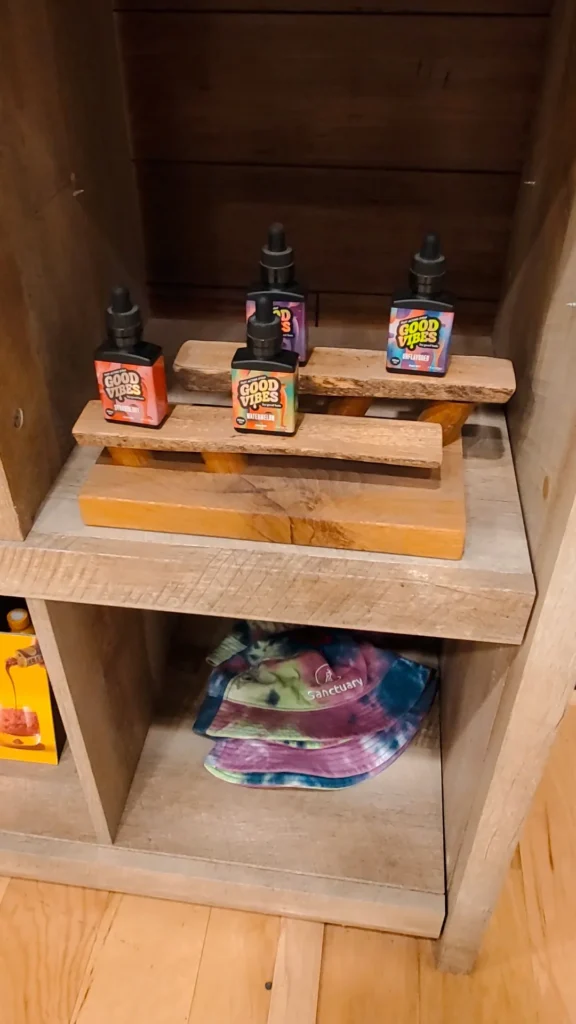 Bottles and colorful display cards at Sanctuary Medicinals - Woburn.