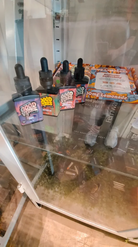 Good Vibes bottles and colorful display cards at Mayflower - Allston.