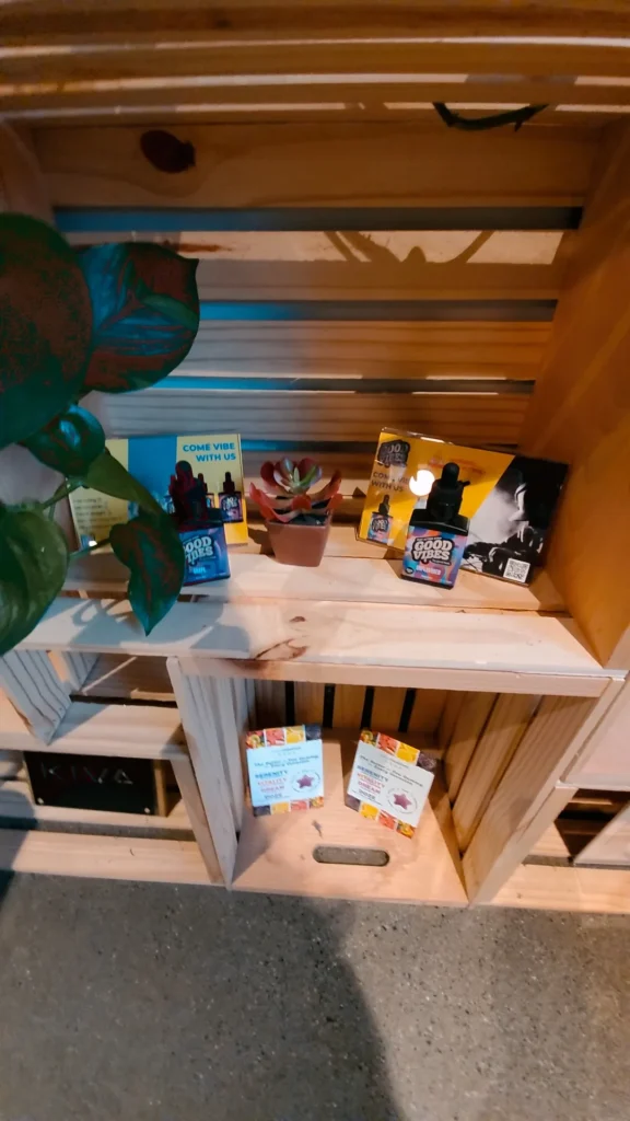 Good Vibes bottles and colorful display cards at Green Meadows - Fitchburg.