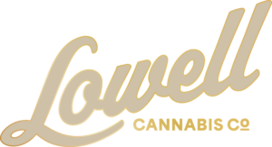Lovell Cannabis Co logo featuring beige cursive script with a gold outline on a dark background (brand logo).