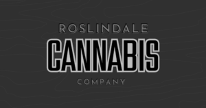 Roslindale Cannabis Company logo on a dark, contour-patterned background; 'ROSLINDALE' top, large outlined 'CANNABIS' in the center, 'COMPANY' below.