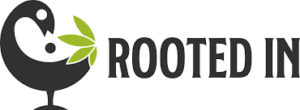 Rooted In logo: black bird on a stem with a green leaf and the text ROOTED IN?