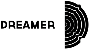 Bold 'DREAMER' text on a green background with a black circular concentric-ring motif on the right edge, resembling a stylized logo.